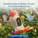 Solar-powered bird feeder with text highlighting power features against a blurred natural background
